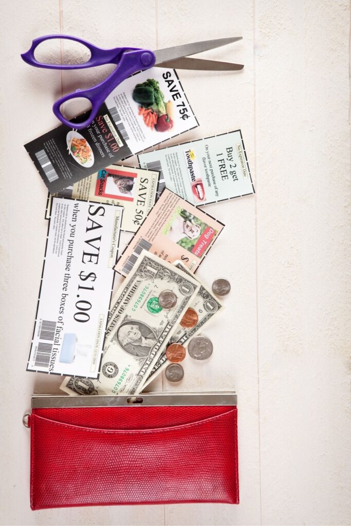 A pouch of coupons, money and scissors to clip coupons with.